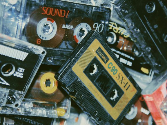 Cassette tapes in a pile.
